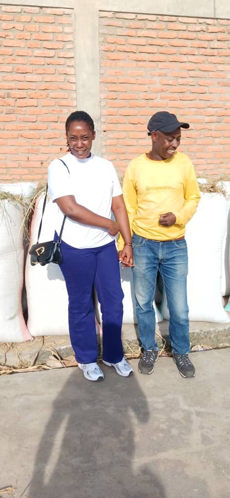 Community members with sacks of harvested grain